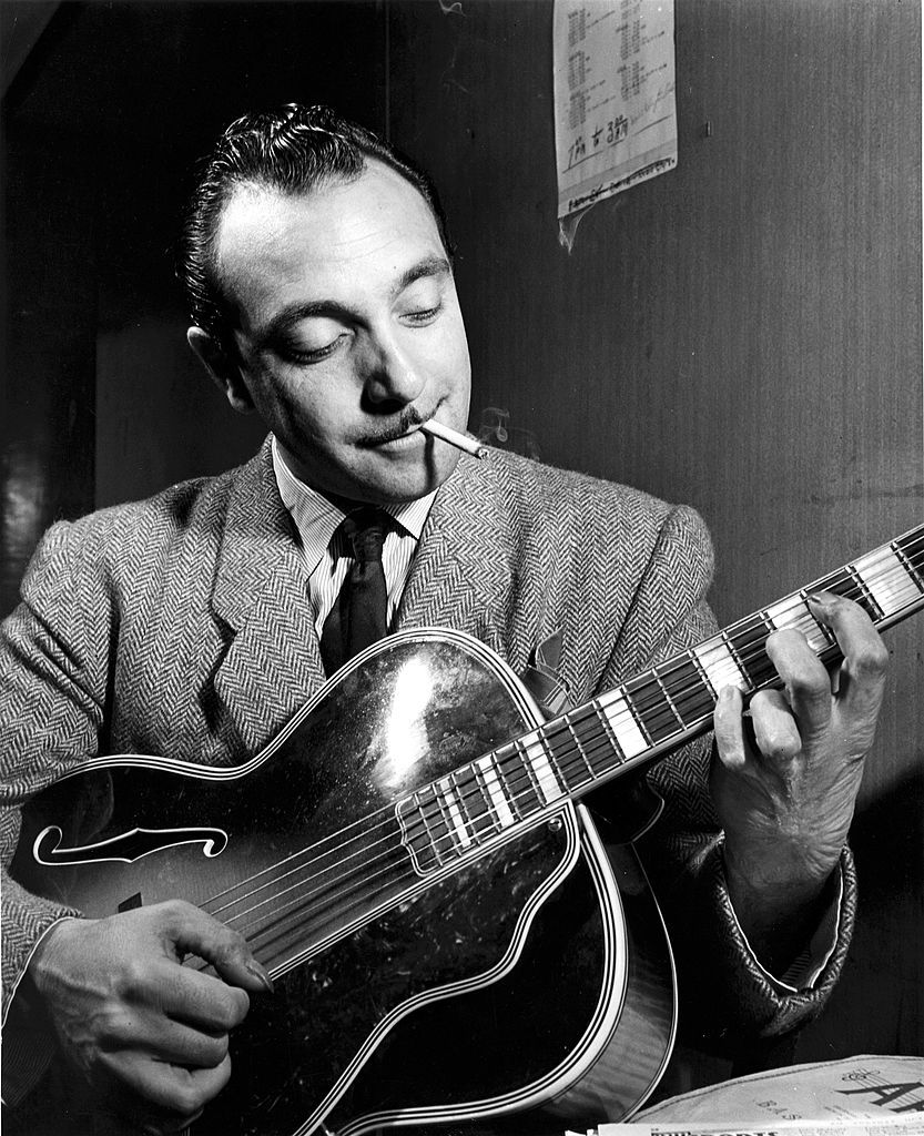 NEW YORK - 1st JANUARY: Photo of Django REINHARDT (1910-1953) playing his guitar backstage in New York in 1946. (Photo by William Gottlieb/Redferns)